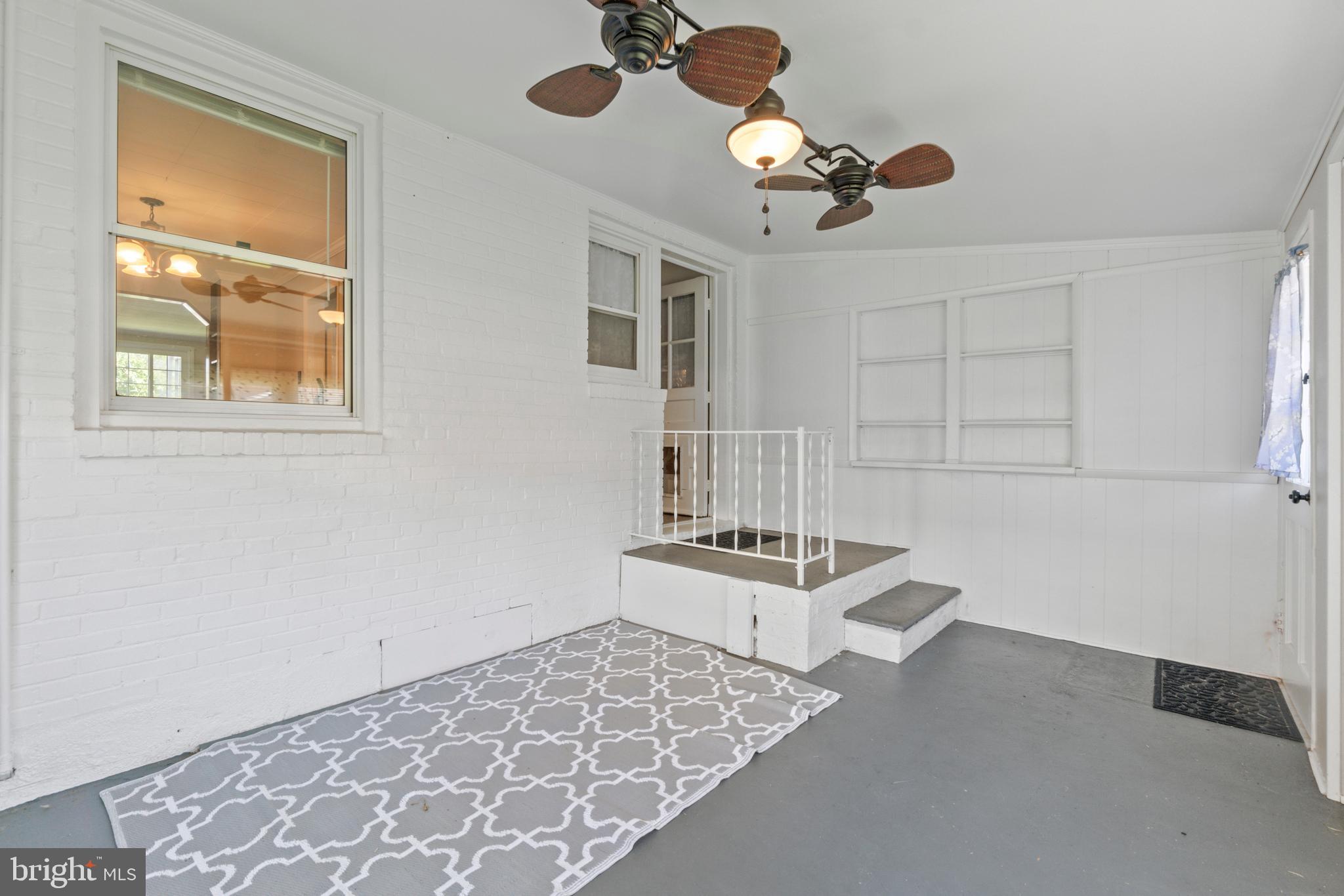 5514 Council Street Halethorpe, MD 21227 - Photo 28 of 36 a view of work space with furniture and chandelier fan