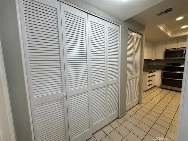 a view of a livingroom with furniture wooden floor windows