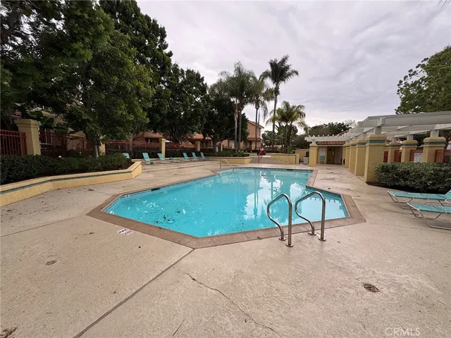 a view of a swimming pool with sitting area