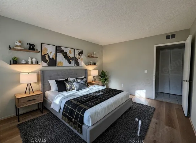 a bedroom with a bed and a walk in closet