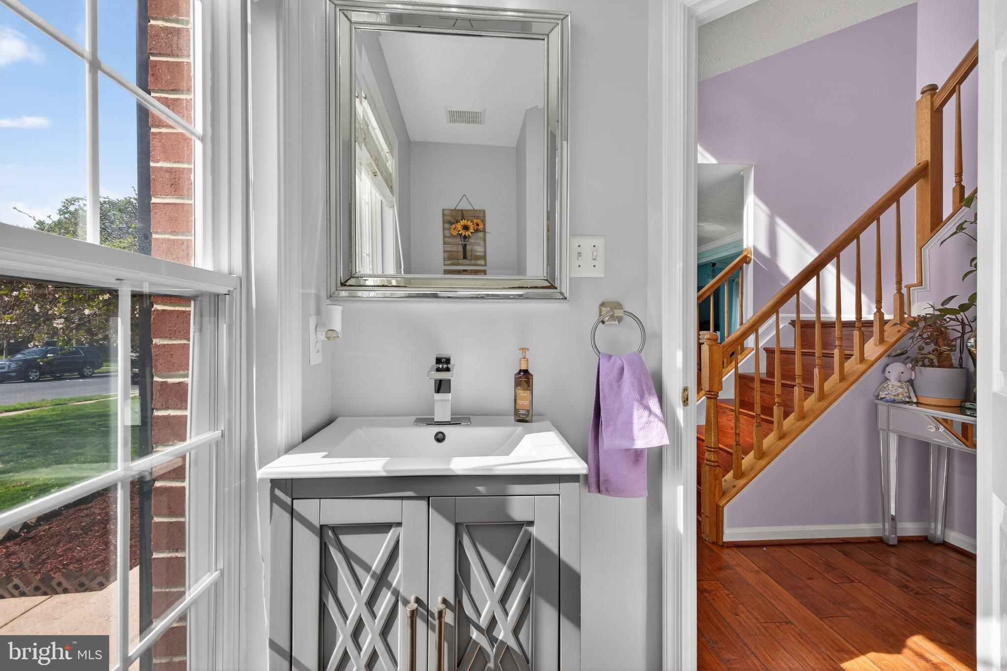 611 Hunting Ridge Drive Frederick, MD 21703 - Photo 24 of 50 a bathroom with a sink and a mirror