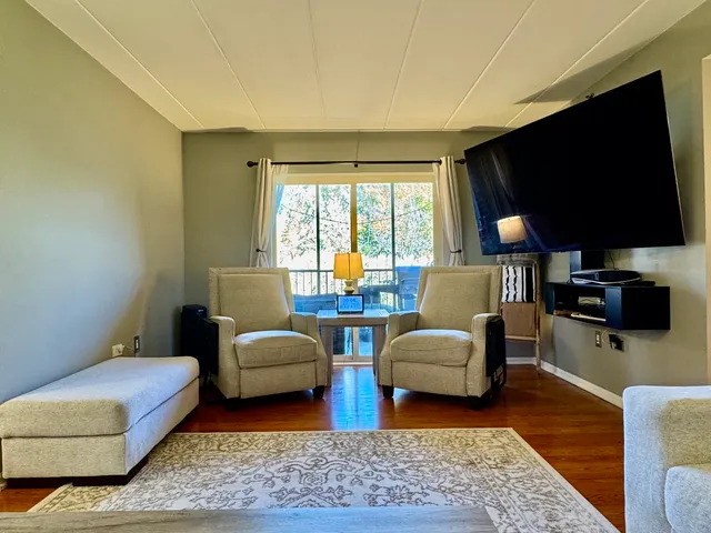 a bathroom with a sink a toilet and shower curtain