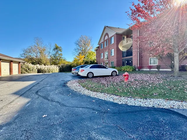 a front view of a house with a yard and outdoor seating