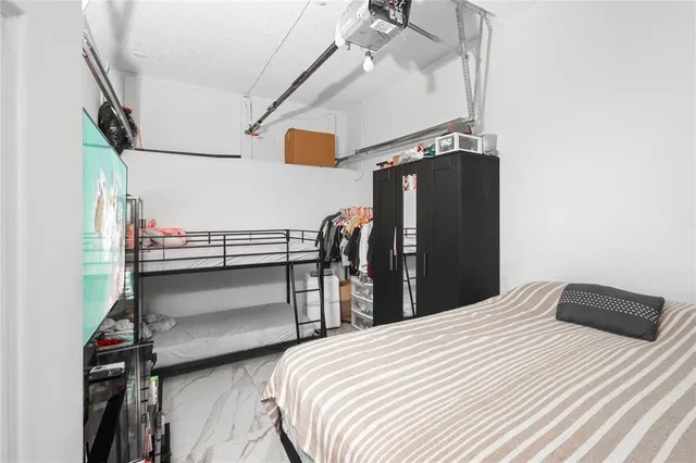a bathroom with a double vanity sink toilet and shower