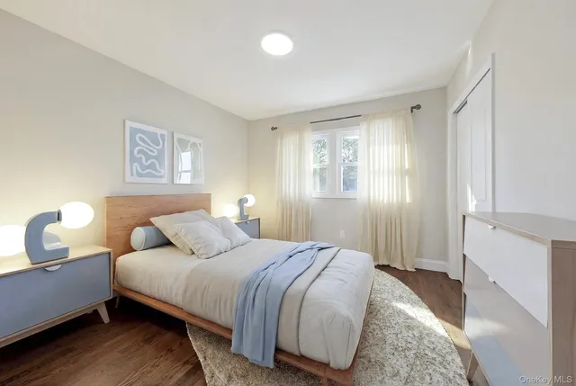 a bedroom with bed and window