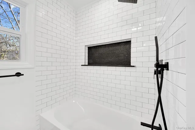 a bathroom with a shower and a bathtub