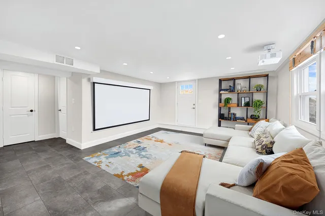 a living room with furniture and large window