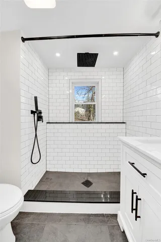a bathroom with a shower and a toilet