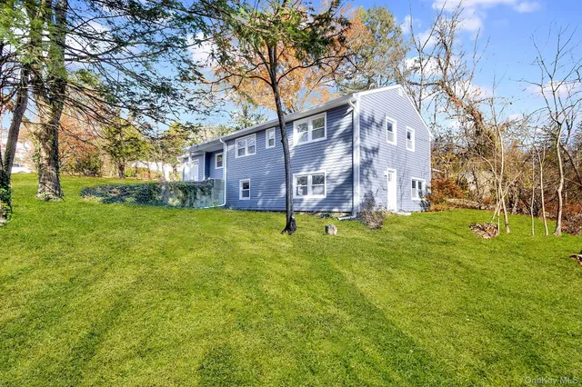 a view of a house with a big yard