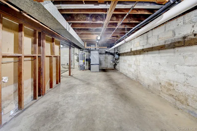 a view of empty room with wooden walls