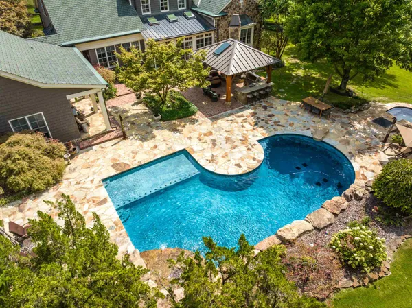 a view of a wooden house with a yard