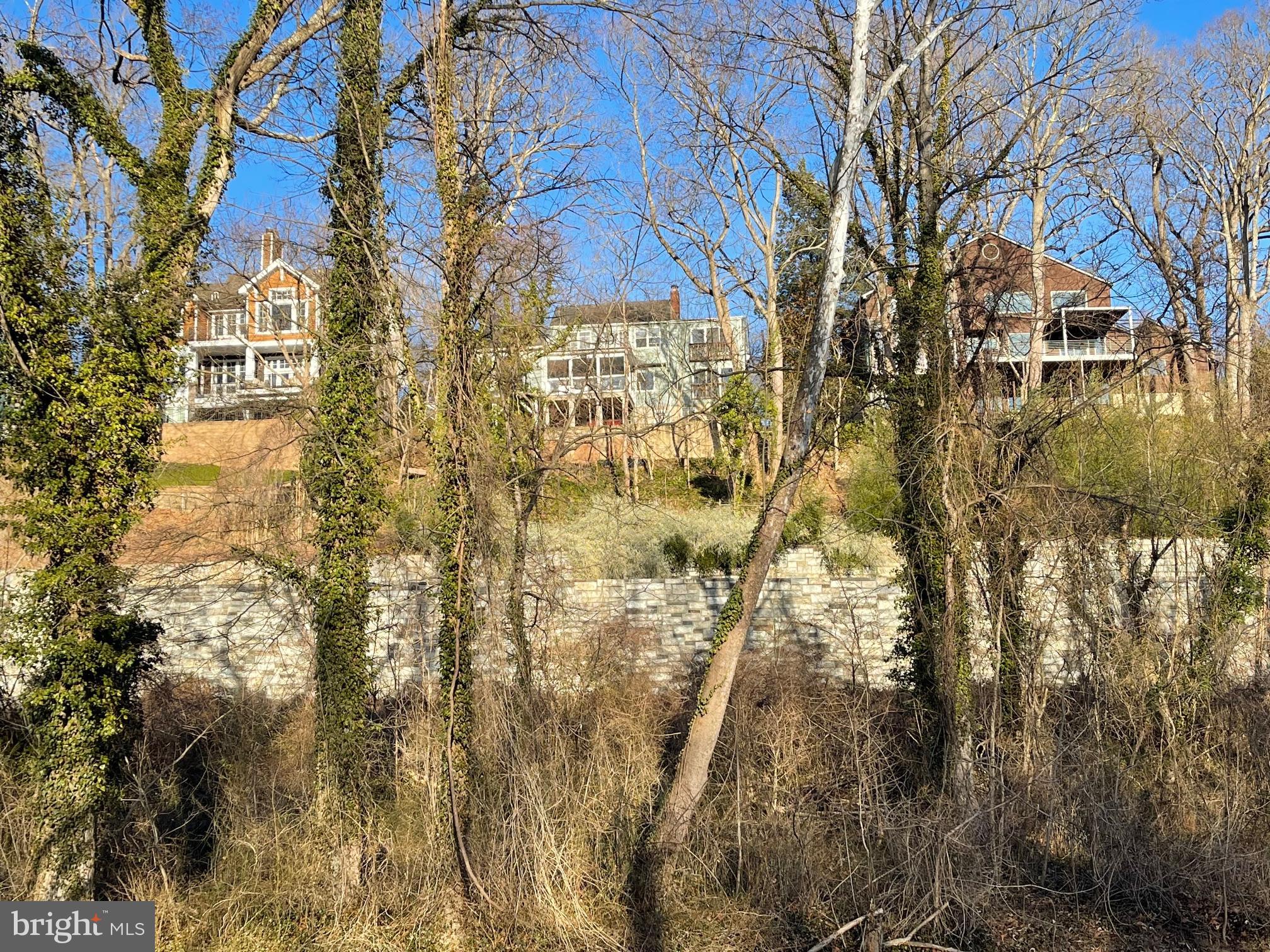 6280 Ridge Drive Bethesda, MD 20816 - Photo 15 of 27 a view of residential houses with snow and trees