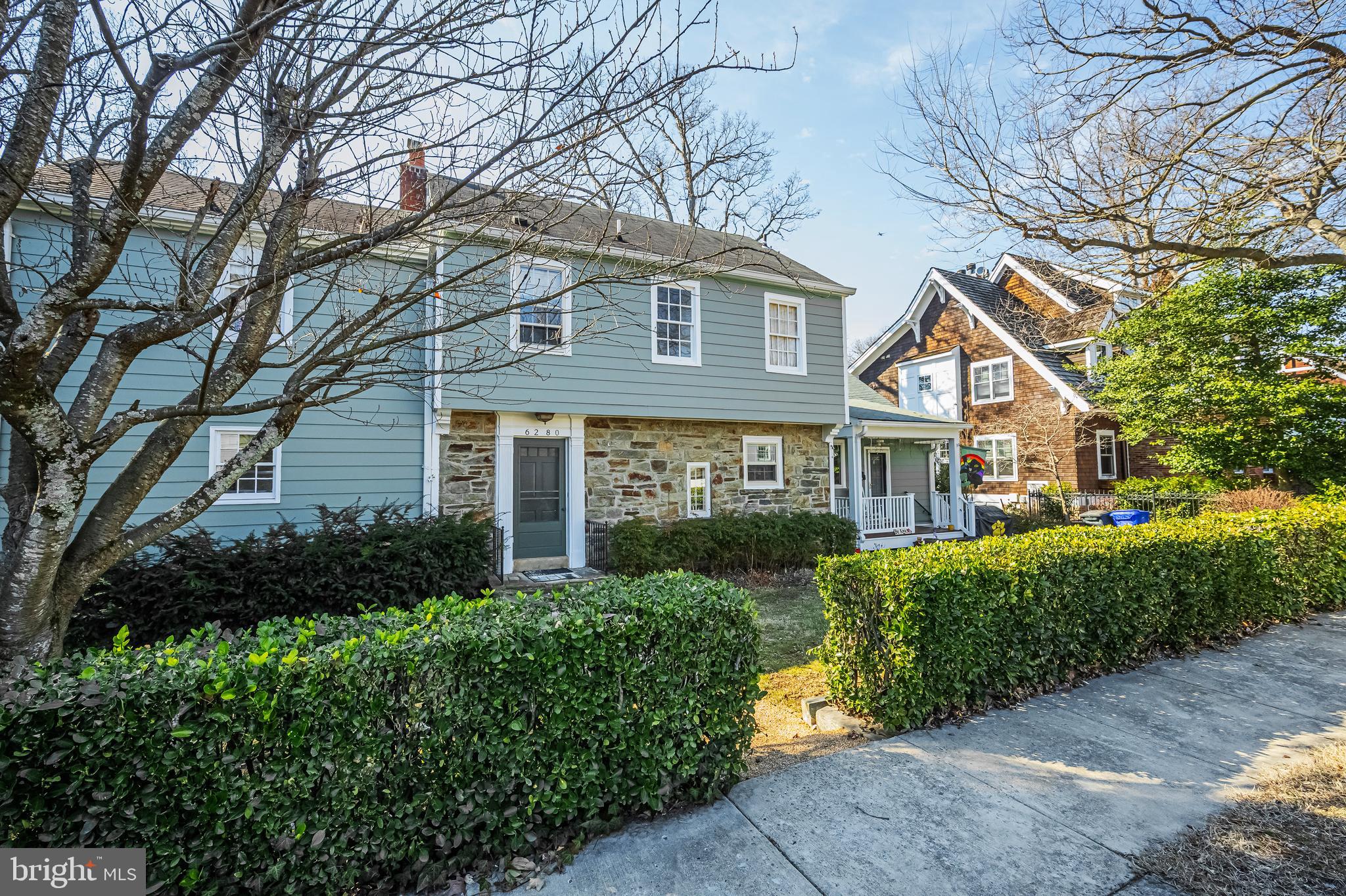 6280 Ridge Drive Bethesda, MD 20816 - Photo 17 of 27 a front view of a house with a yard and green space