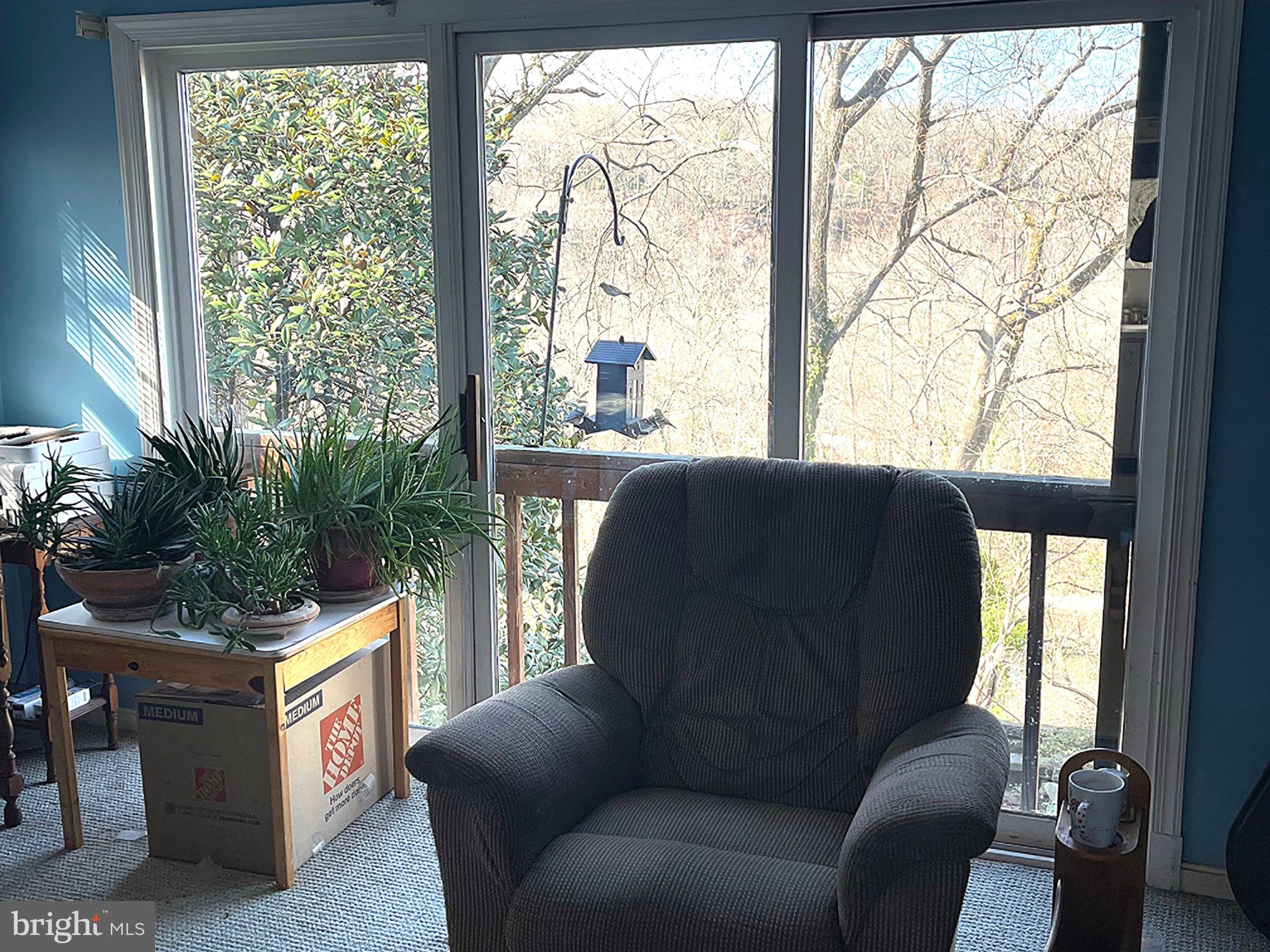 6280 Ridge Drive Bethesda, MD 20816 - Photo 24 of 27 a living room with furniture and a floor to ceiling window