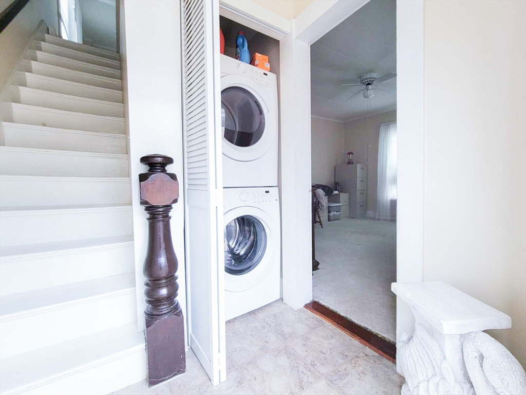 68 Durham Road Dover, NH 03820 - Photo 11 of 23 a view of a hallway with washer and dryer