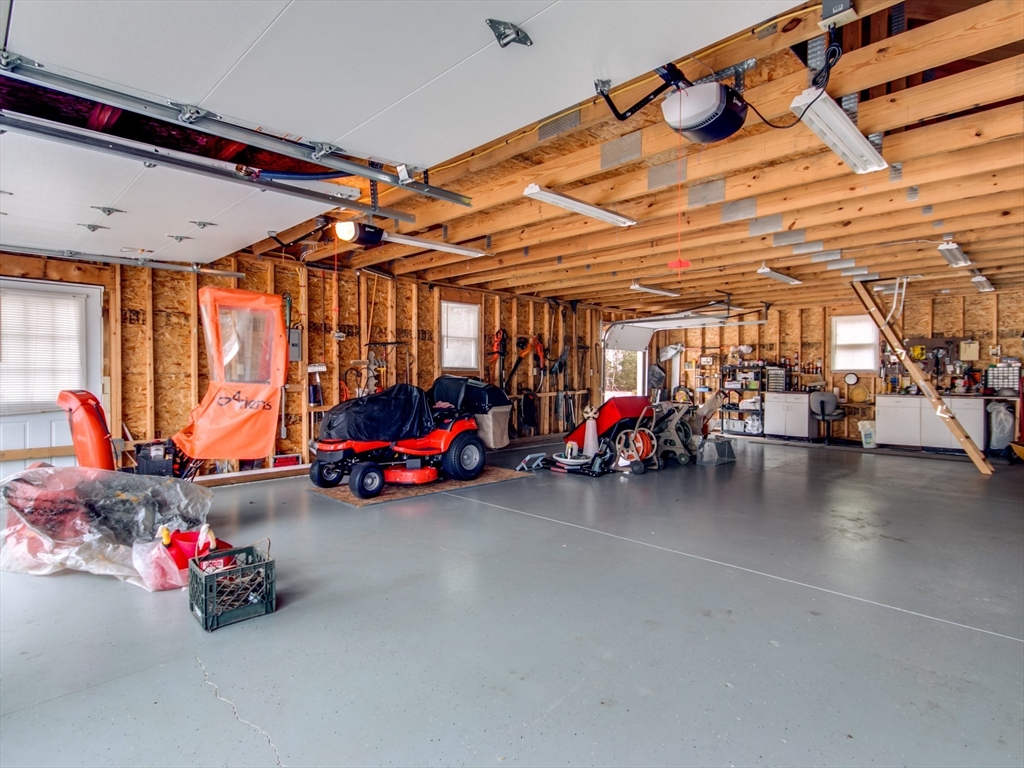 68 Durham Road Dover, NH 03820 - Photo 18 of 23 a view of a garage with a tv