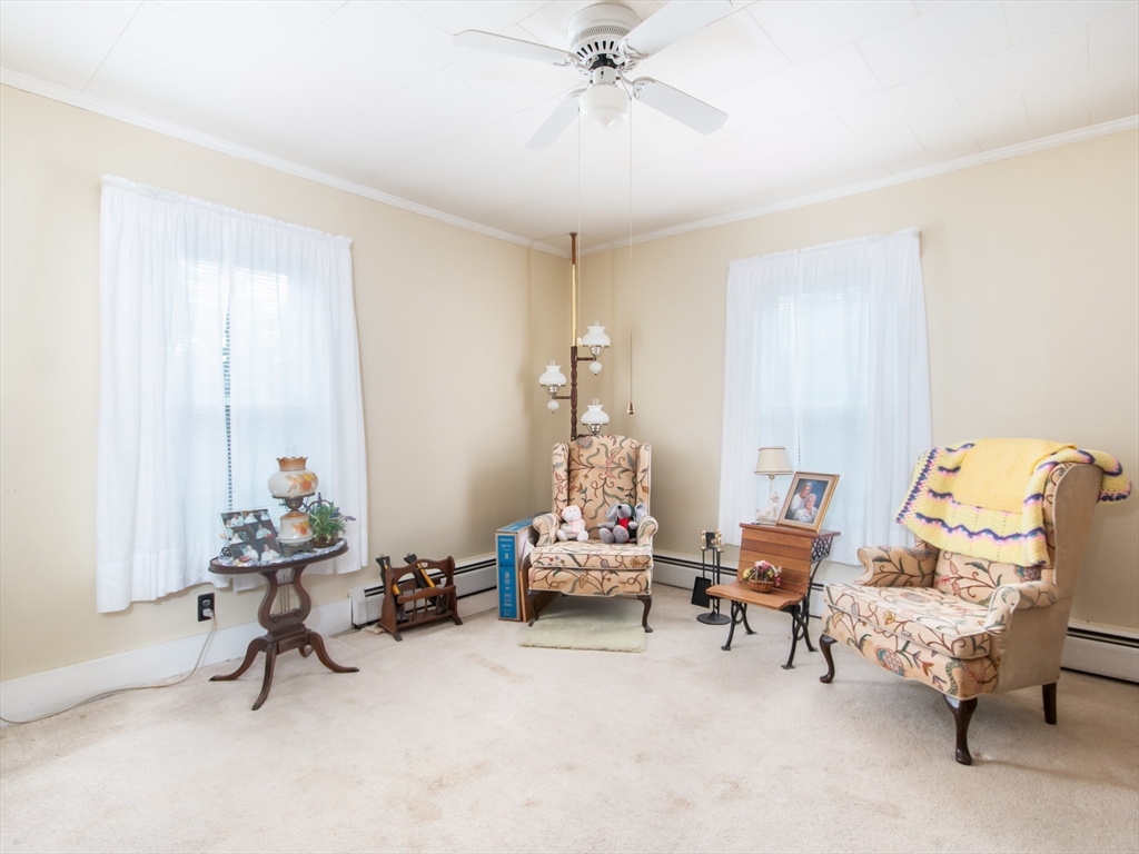 68 Durham Road Dover, NH 03820 - Photo 6 of 23 a bedroom with furniture and a chandelier