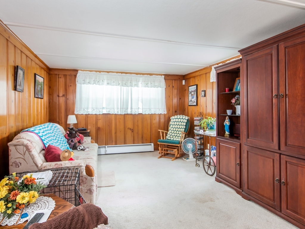 68 Durham Road Dover, NH 03820 - Photo 9 of 23 a bedroom with furniture and a window