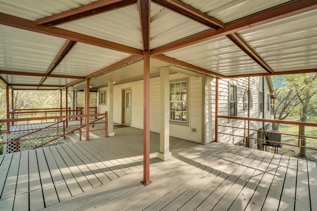 488 Loma Linda Road Palmer, TX 75152 - Photo 21 of 39 a view of a balcony with wooden floor