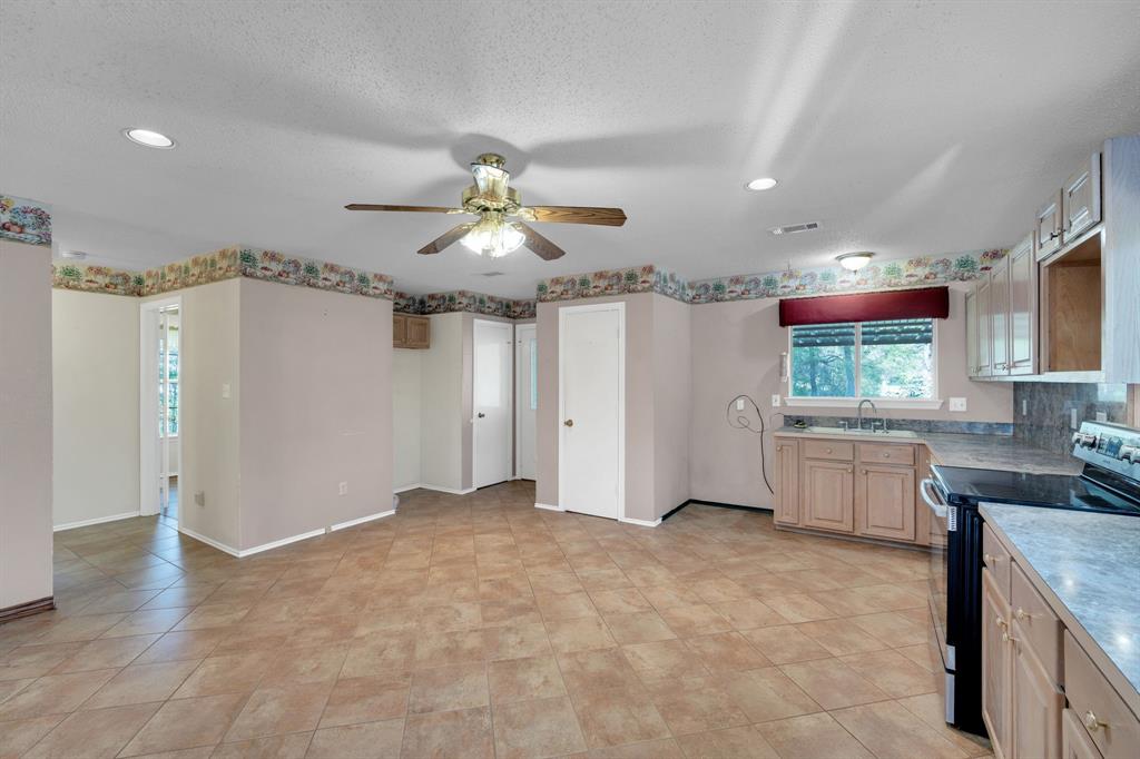 488 Loma Linda Road Palmer, TX 75152 - Photo 26 of 39 a view of a kitchen with furniture and a window