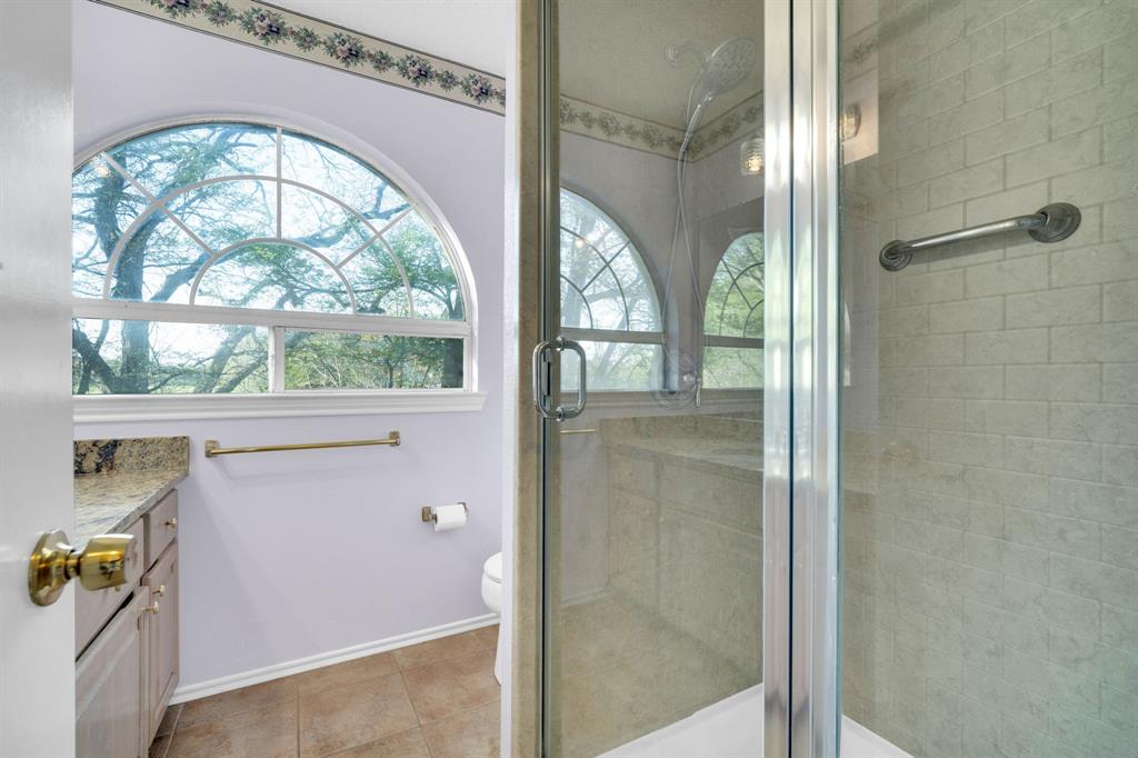 488 Loma Linda Road Palmer, TX 75152 - Photo 31 of 39 a bathroom with a glass shower door