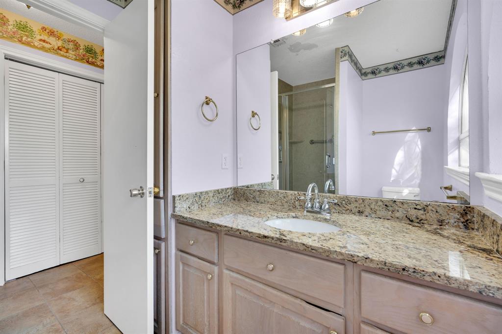 488 Loma Linda Road Palmer, TX 75152 - Photo 32 of 39 a bathroom with a granite countertop sink and a mirror