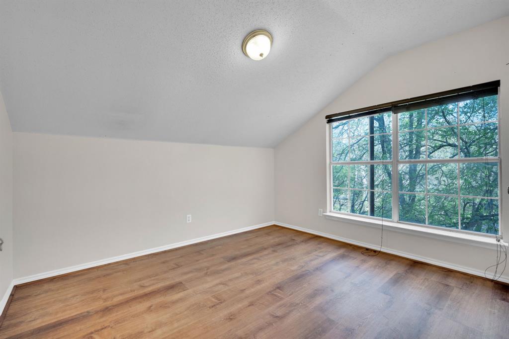 488 Loma Linda Road Palmer, TX 75152 - Photo 33 of 39 wooden floor in an empty room with a window