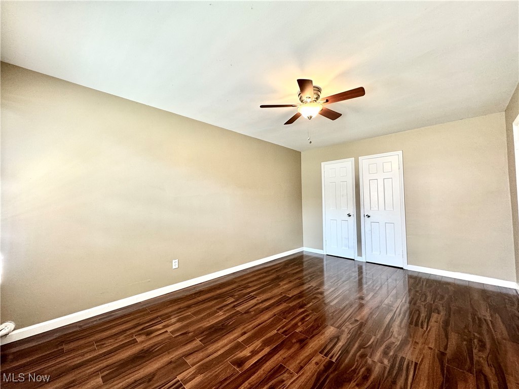 13805 Cedar Road, Unit 103C Cleveland, OH 44118 - Photo 13 of 18 Bedroom with ceiling fan and dark wood-style flooring