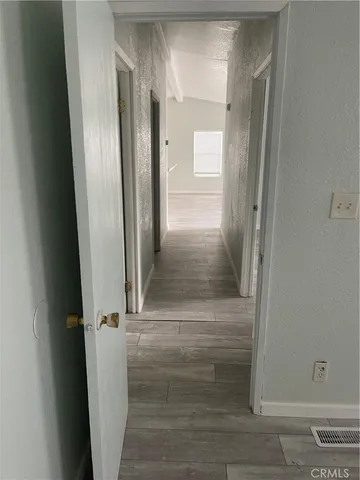 a room with a fireplace and a window