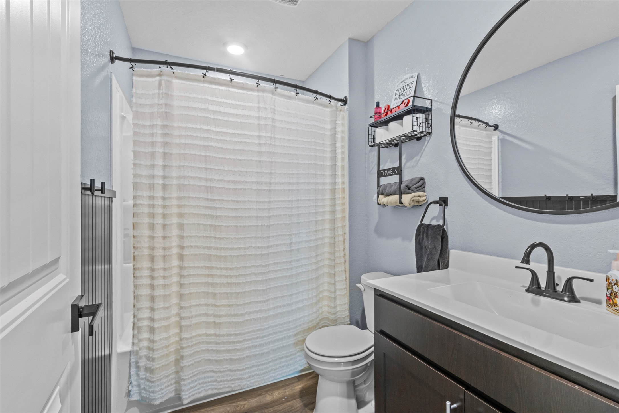 339 Euclid Lane Kyle, TX 78640 - Photo 15 of 17 a bathroom with a sink a toilet and shower