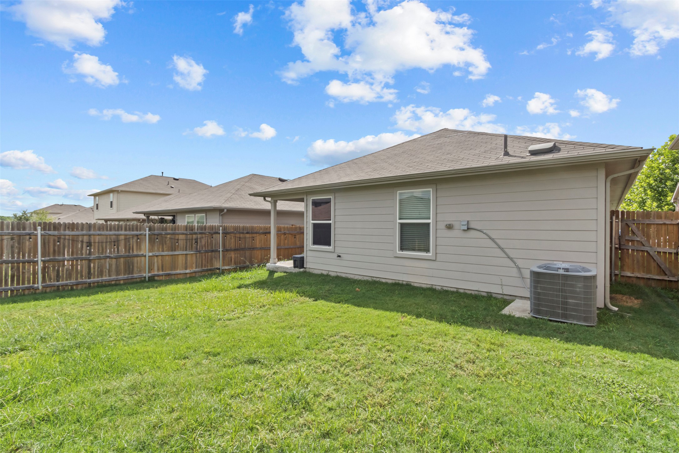 339 Euclid Lane Kyle, TX 78640 - Photo 17 of 17 a view of a backyard with a garden