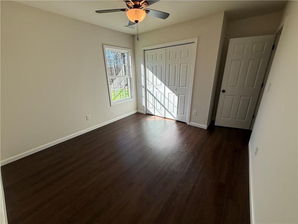 275 Red Oak Flats Road Dahlonega, GA 30533 - Photo 14 of 16 a view of an empty room with wooden floor and a window