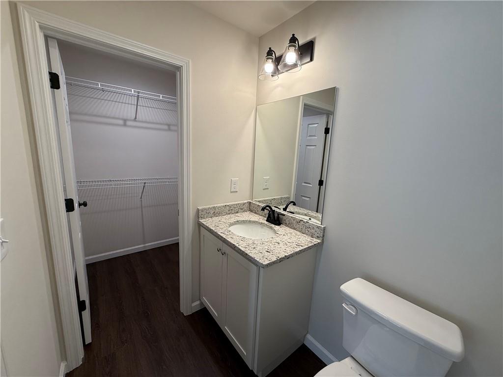 275 Red Oak Flats Road Dahlonega, GA 30533 - Photo 8 of 16 a bathroom with a toilet sink and mirror