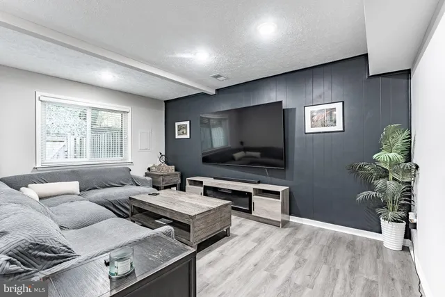 a bedroom with a bed and a night stand