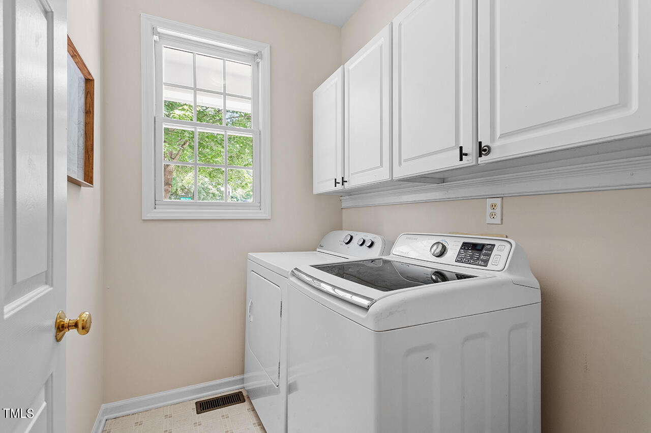 12601 Waterlow Park Lane Raleigh, NC 27614 - Photo 19 of 38 a utility room with dryer and washer