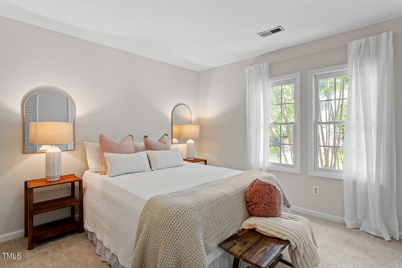 12601 Waterlow Park Lane Raleigh, NC 27614 - Photo 25 of 38 a bedroom with a bed and a window