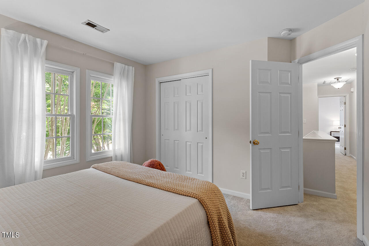 12601 Waterlow Park Lane Raleigh, NC 27614 - Photo 26 of 38 a bedroom with a bed and a window