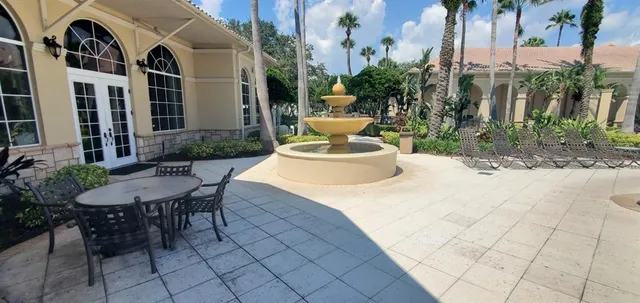 a view of a patio with furniture