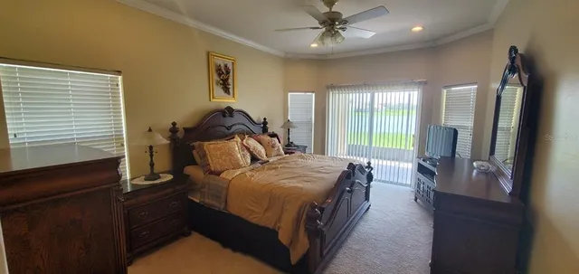 a bed room with a bed and a television