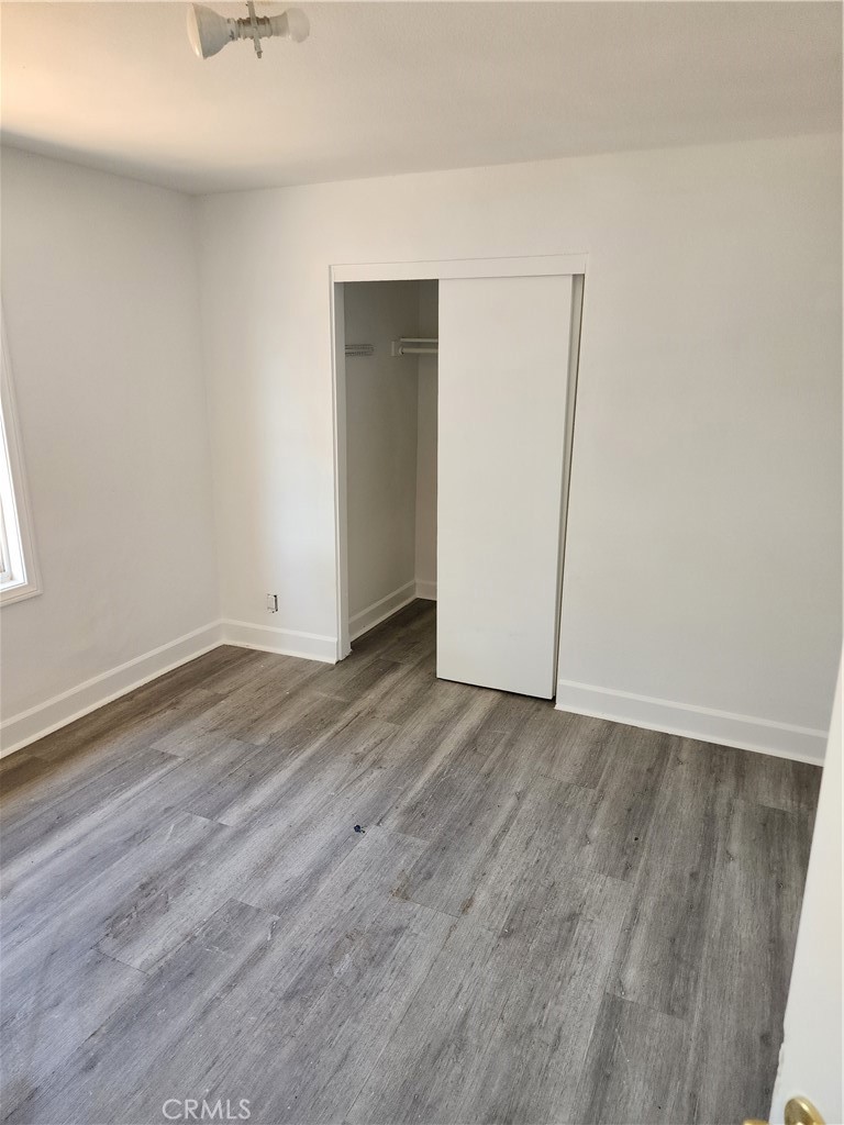 6420 Stover Avenue Riverside, CA 92505 - Photo 2 of 13 an empty room with wooden floor