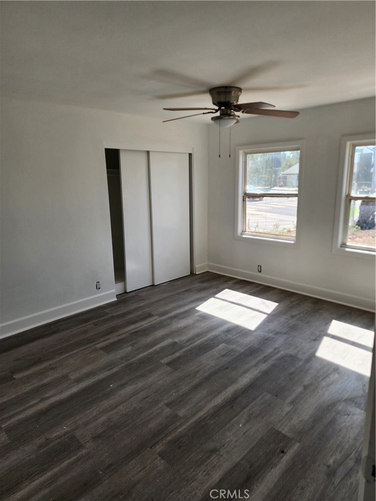 6420 Stover Avenue Riverside, CA 92505 - Photo 4 of 13 a view of empty room with wooden floor and fan
