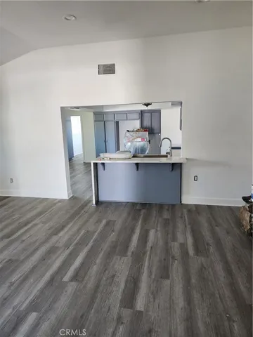 a view of kitchen and wooden floor