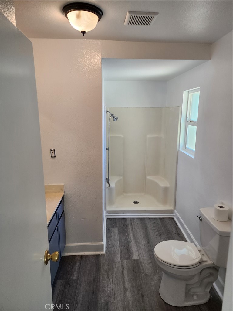 6420 Stover Avenue Riverside, CA 92505 - Photo 7 of 13 a bathroom with a toilet and a shower
