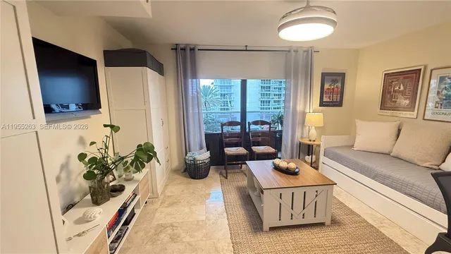 a view of a balcony with table and chairs