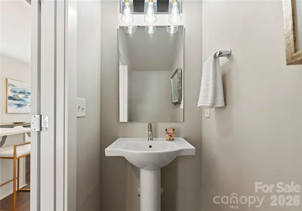 a bathroom with a sink and mirror