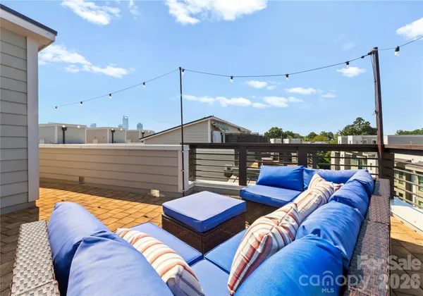 a view of a terrace with furniture