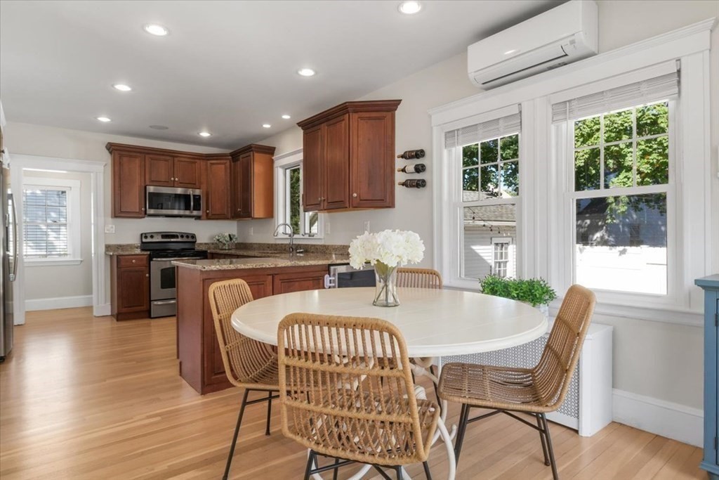 35 Clinton Road Weymouth, MA 02189 - Photo 11 of 37 a view of a dining room with furniture window and wooden floor