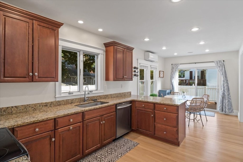 35 Clinton Road Weymouth, MA 02189 - Photo 14 of 37 a kitchen with lots of counter top space and wooden floor