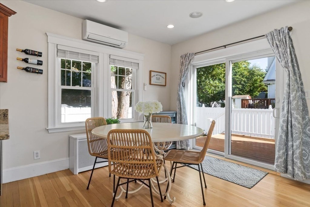 35 Clinton Road Weymouth, MA 02189 - Photo 15 of 37 a view of a dining room with furniture and wooden floor
