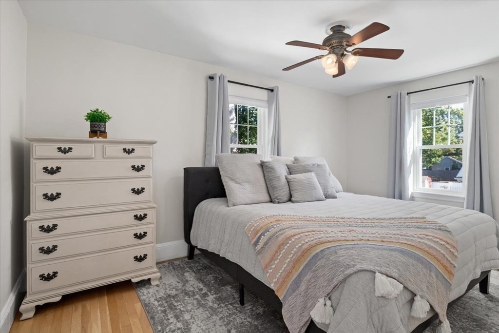 35 Clinton Road Weymouth, MA 02189 - Photo 21 of 37 a large bed sitting in a bedroom next to a window